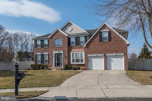 colonial inspired home featuring a front yard, brick siding, fence, and driveway