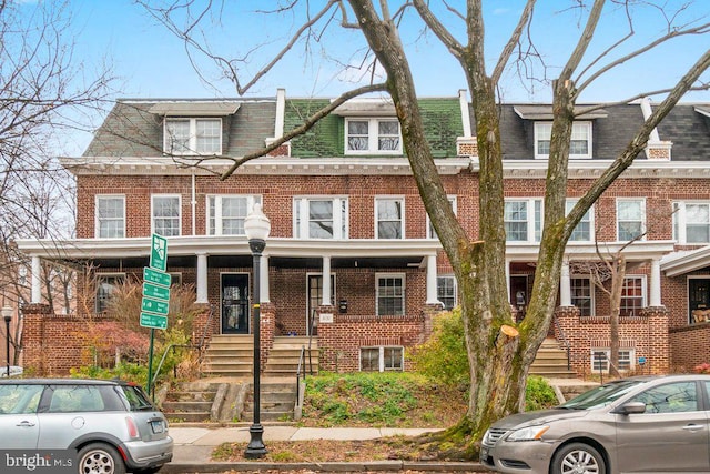 view of property with brick siding