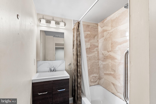 full bathroom with shower / tub combo with curtain and vanity