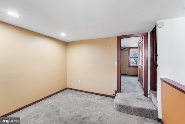 unfurnished room with recessed lighting, carpet flooring, and baseboards