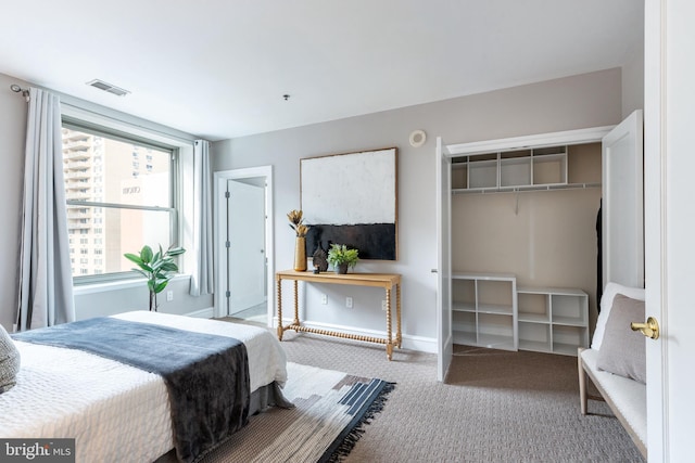 bedroom featuring carpet floors, visible vents, and baseboards