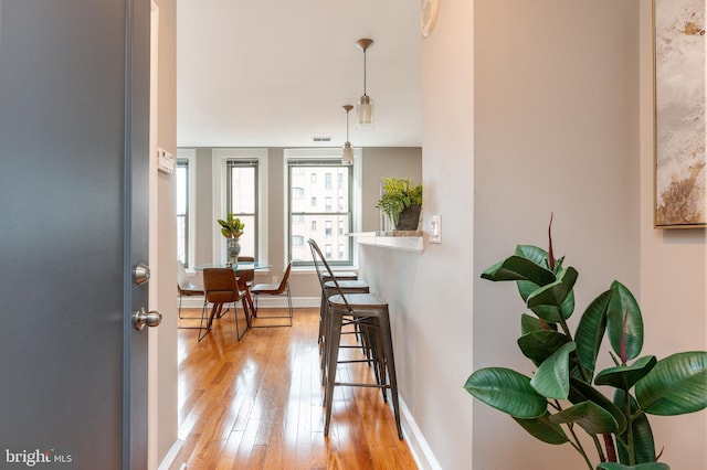 interior space featuring light wood-style floors and baseboards