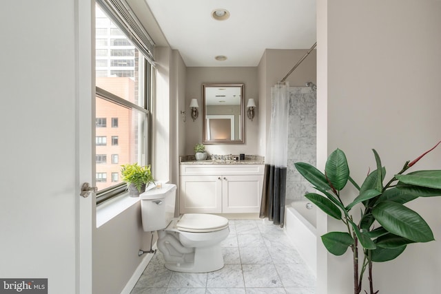 bathroom with marble finish floor, shower / bath combo with shower curtain, vanity, and toilet