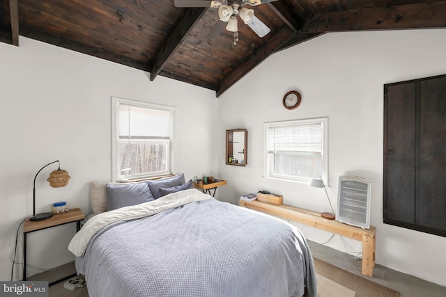 bedroom featuring a ceiling fan, wooden ceiling, multiple windows, and lofted ceiling with beams