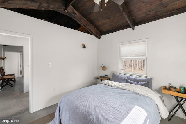 bedroom featuring concrete flooring, wooden ceiling, and lofted ceiling with beams