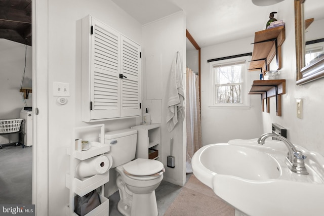 bathroom with toilet, concrete flooring, and a shower with shower curtain