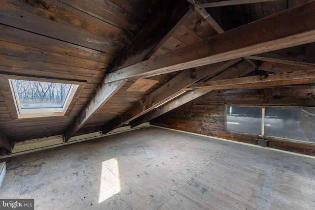 attic featuring a skylight