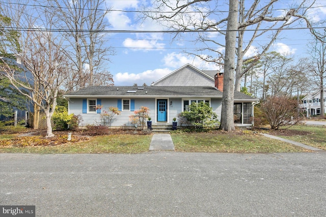 view of front of property with a chimney