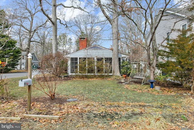 view of yard with a sunroom