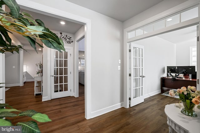 entryway featuring french doors, baseboards, and wood finished floors