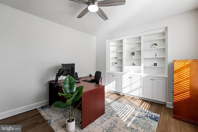 office space featuring ceiling fan, baseboards, and wood finished floors