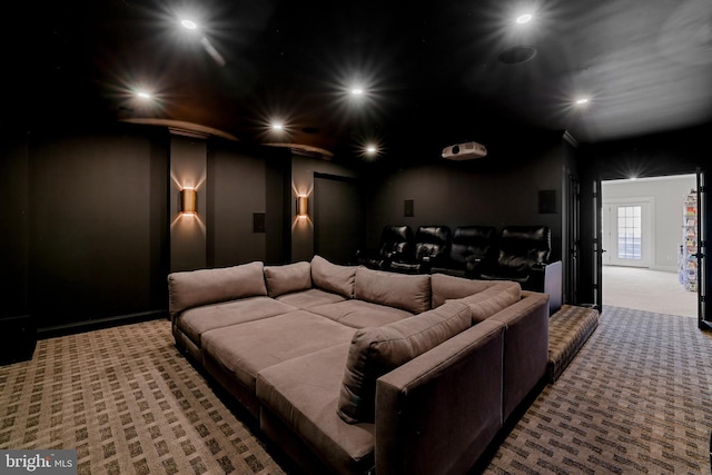 carpeted cinema room with recessed lighting