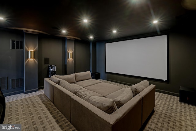 carpeted cinema with visible vents and recessed lighting