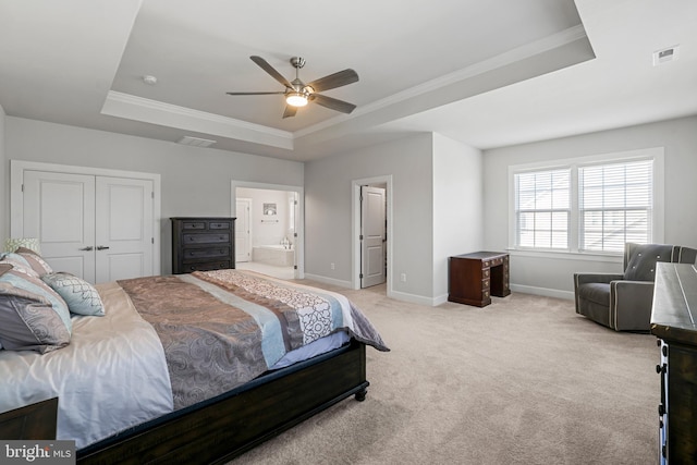 bedroom with light carpet, baseboards, visible vents, and a raised ceiling