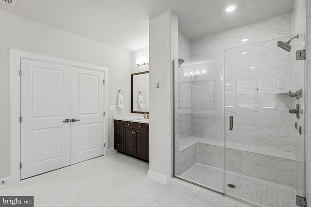 full bathroom featuring visible vents, vanity, baseboards, marble finish floor, and a marble finish shower