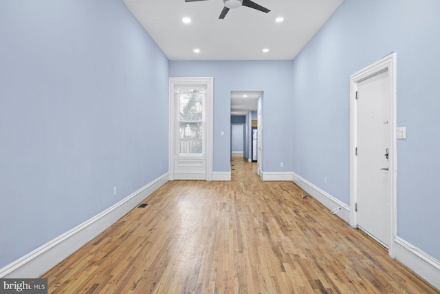 empty room with recessed lighting, visible vents, a ceiling fan, baseboards, and hardwood / wood-style flooring