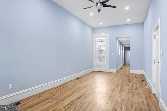 empty room with ceiling fan, recessed lighting, visible vents, baseboards, and light wood finished floors