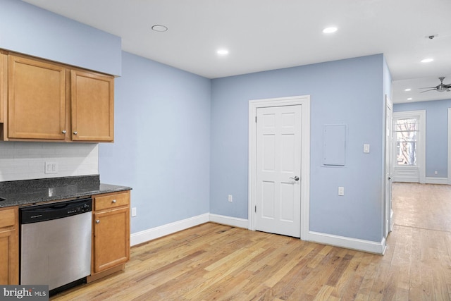 kitchen with tasteful backsplash, light wood-type flooring, dishwasher, and baseboards