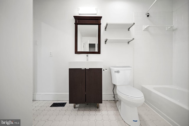 bathroom with baseboards, vanity, toilet, and bathing tub / shower combination