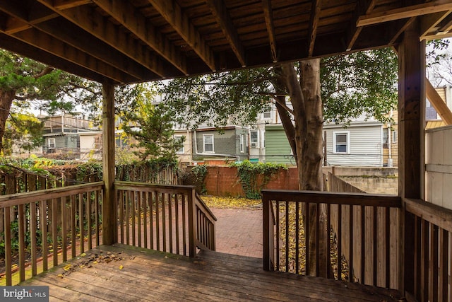 wooden deck featuring fence