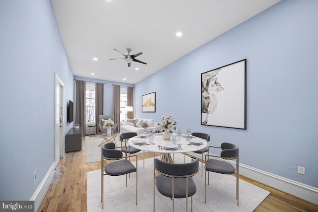 dining space featuring recessed lighting, ceiling fan, baseboards, and wood finished floors