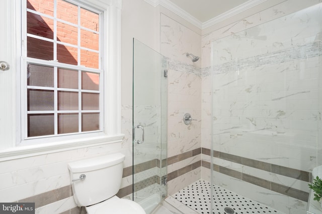 full bath with ornamental molding, a shower stall, and toilet