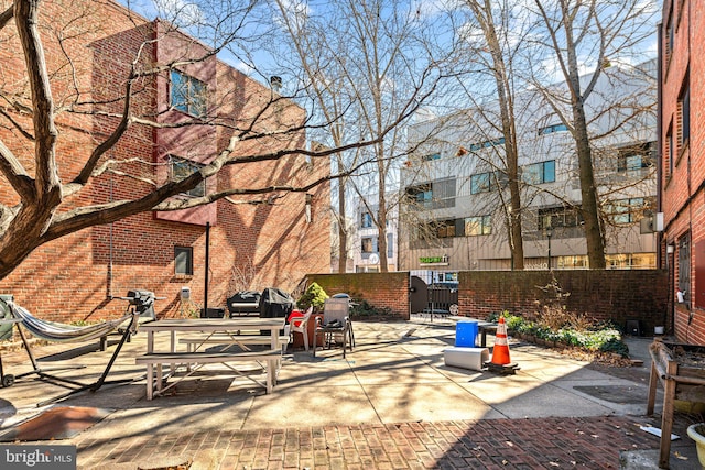 surrounding community with a gate, a patio area, and fence