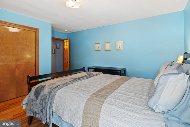 bedroom with wood finished floors