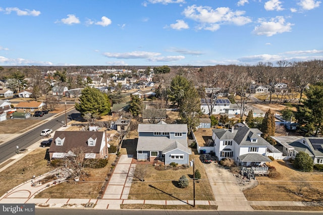 birds eye view of property with a residential view