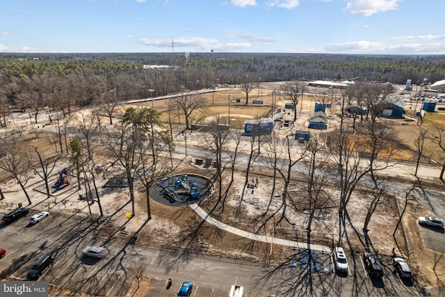 bird's eye view featuring a wooded view