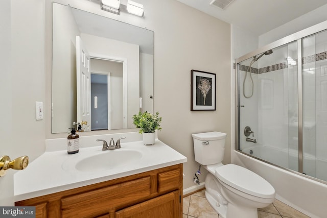 full bath with toilet, tile patterned flooring, combined bath / shower with glass door, and vanity