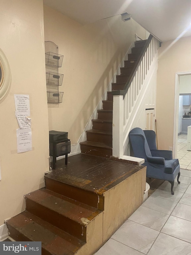 staircase with tile patterned floors