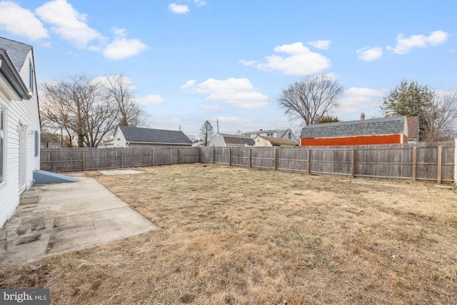 view of yard with a fenced backyard and a patio