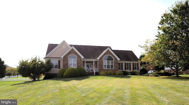 ranch-style house with a front lawn