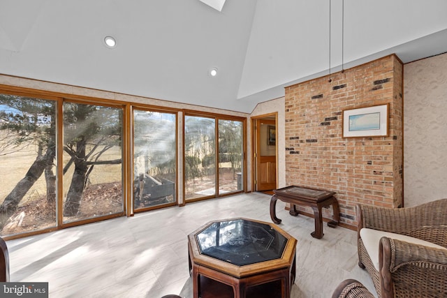 living area with a towering ceiling