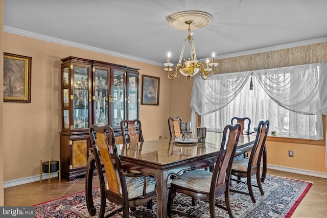 dining area with a chandelier, light tile patterned flooring, baseboards, and crown molding