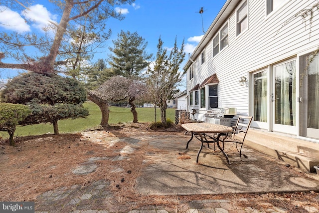 view of patio with outdoor dining area and area for grilling