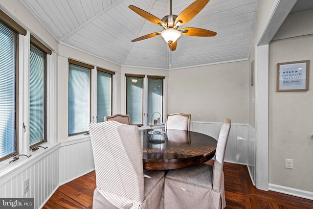 dining space featuring wood ceiling, wainscoting, ceiling fan, vaulted ceiling, and wood finished floors