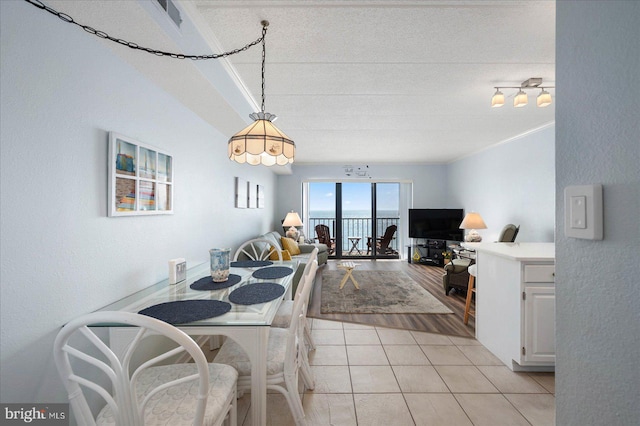 dining space with light tile patterned floors