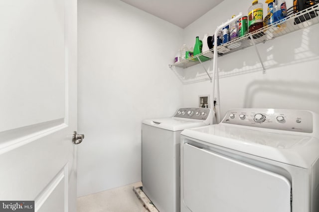 laundry room with washer and dryer and laundry area