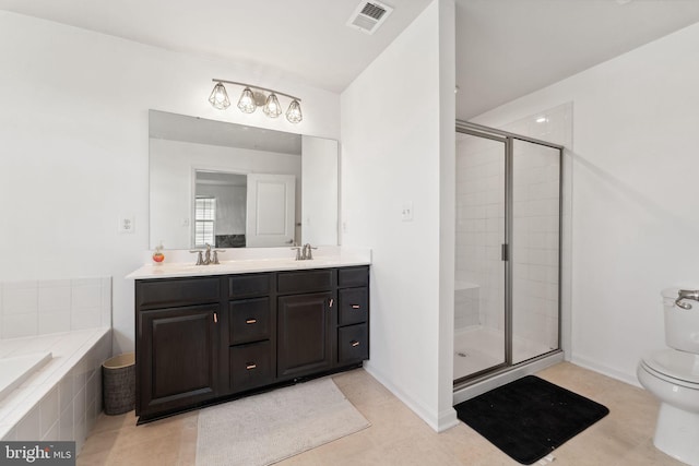 bathroom with visible vents, a shower stall, double vanity, toilet, and a sink