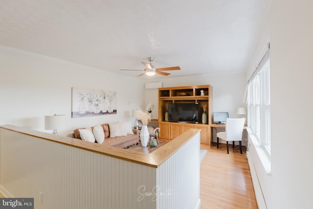 living room with light wood-style floors and ceiling fan
