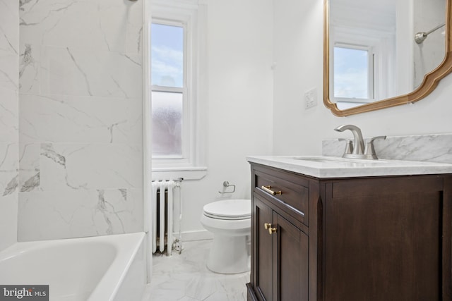 bathroom featuring a washtub, marble finish floor, radiator, toilet, and vanity