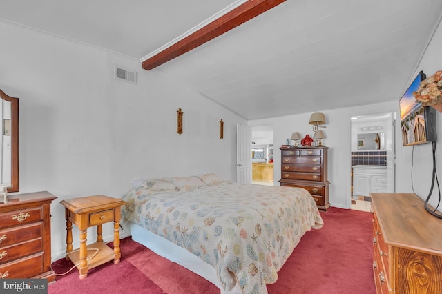 bedroom featuring lofted ceiling with beams, visible vents, dark carpet, ensuite bath, and crown molding