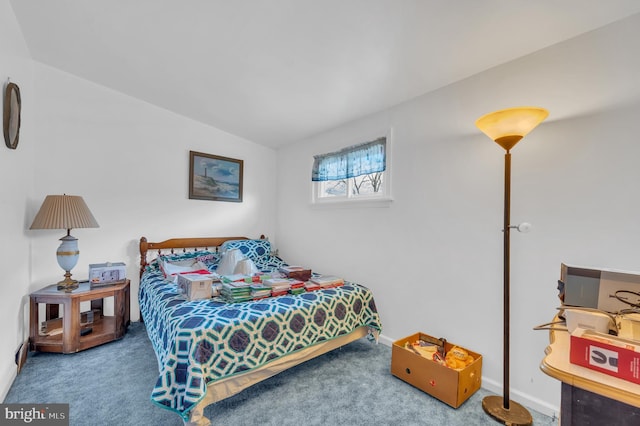 bedroom featuring carpet floors, baseboards, and vaulted ceiling