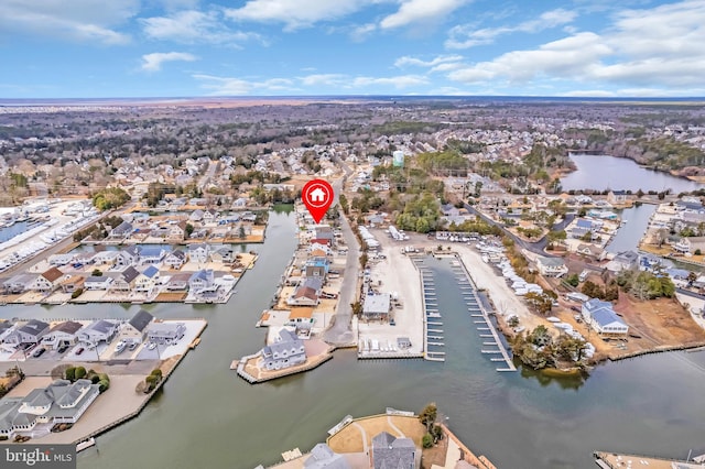 drone / aerial view with a water view and a residential view