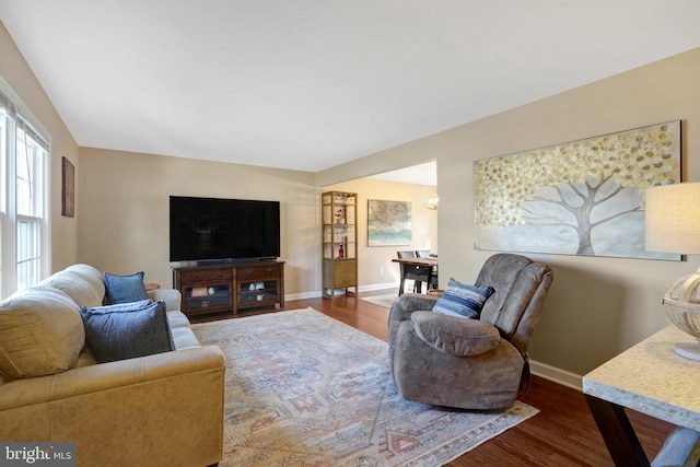 living room with wood finished floors and baseboards