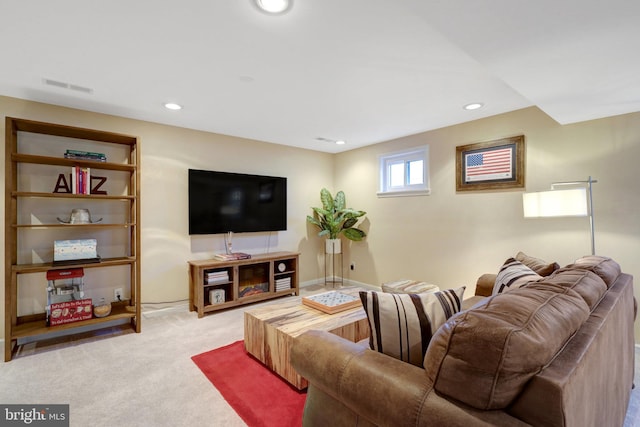 carpeted living room featuring recessed lighting, visible vents, and baseboards