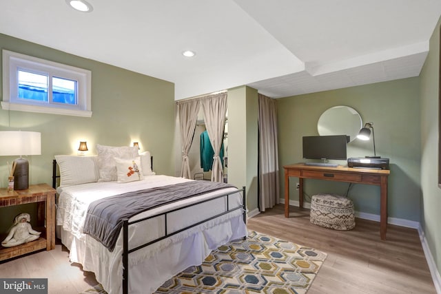 bedroom featuring light wood-type flooring, baseboards, and recessed lighting