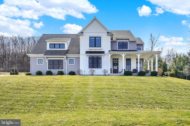 modern farmhouse style home with a porch, a front lawn, and roof with shingles